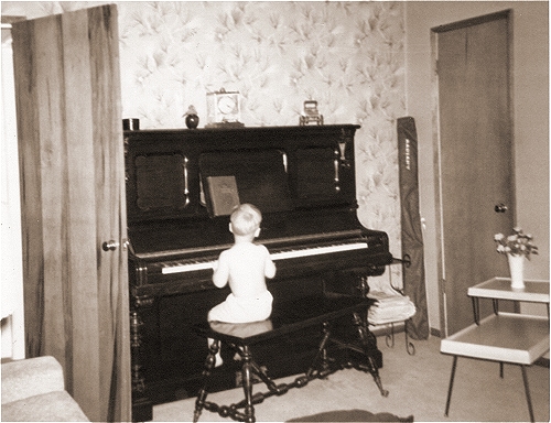Bill playing piano at 2 years, 2 months